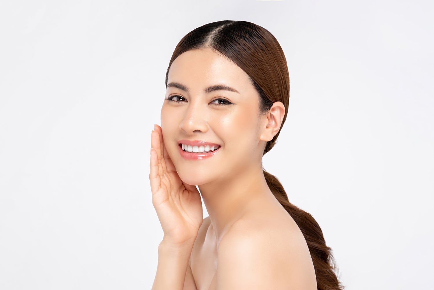 asian-woman-smiling-with-hand-touching-face-beauty-skin-care-concepts